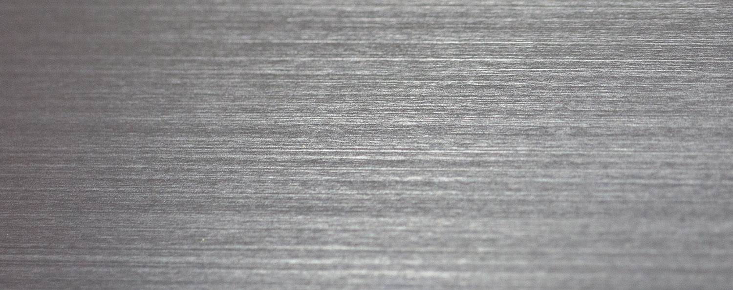 closeup of linear grains on metal surface